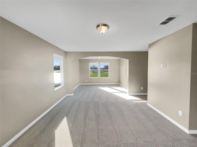 unfurnished room with carpet floors