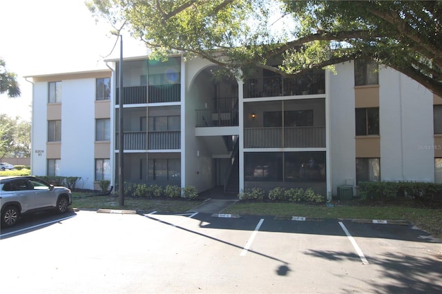 8209 Sun Spring Cir Unit 22, Orlando, FL 32825 - view of building exterior featuring central AC unit