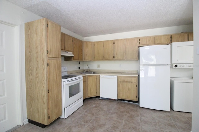 8209 Sun Spring Cir Unit 22, Orlando, FL 32825 - kitchen with white appliances, stacked washer / drying machine, a textured ceiling, and light brown cabinets