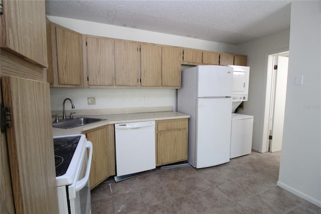 8209 Sun Spring Cir Unit 22, Orlando, FL 32825 - kitchen with a textured ceiling, stacked washing maching and dryer, sink, and white appliances