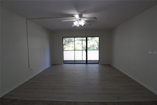 8209 Sun Spring Cir Unit 22, Orlando, FL 32825 - unfurnished room with ceiling fan, a textured ceiling, and dark hardwood / wood-style flooring