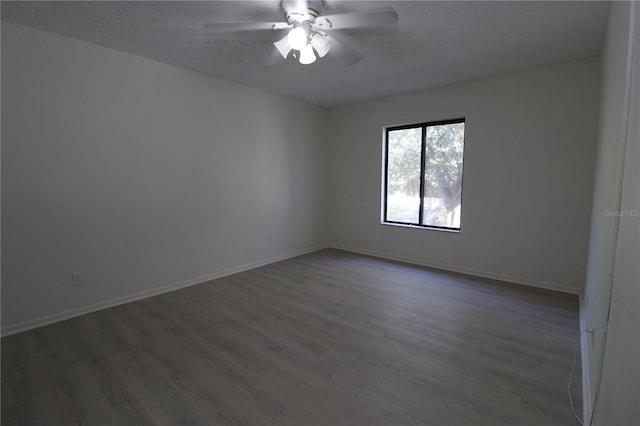 8209 Sun Spring Cir Unit 22, Orlando, FL 32825 - unfurnished room featuring ceiling fan, a textured ceiling, and dark hardwood / wood-style floors