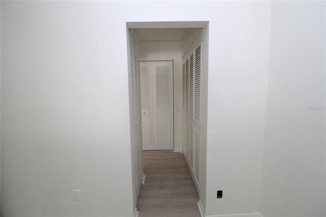 8209 Sun Spring Cir Unit 22, Orlando, FL 32825 - hallway with light hardwood / wood-style flooring