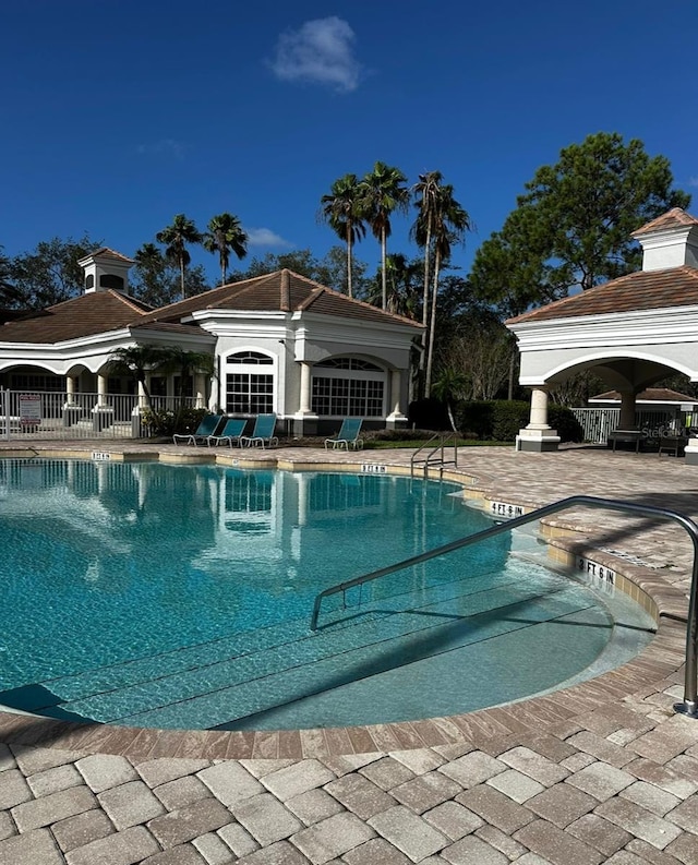 view of swimming pool with a patio