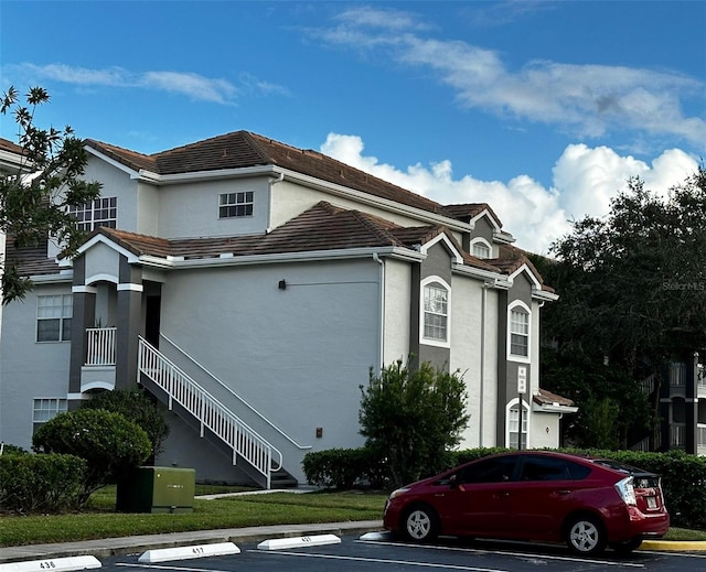 view of home's exterior with a lawn