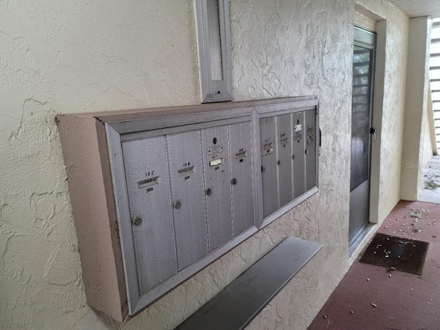 exterior details with carpet floors and a mail area