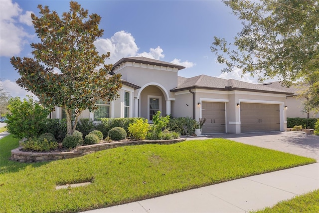 view of front facade with a front yard and a garage