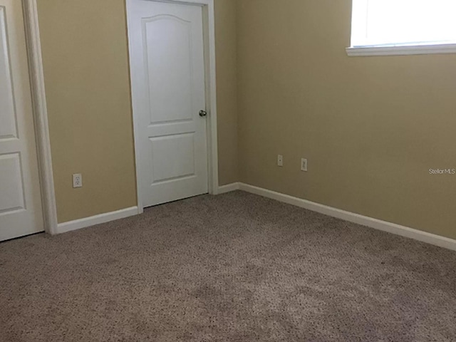 empty room featuring carpet