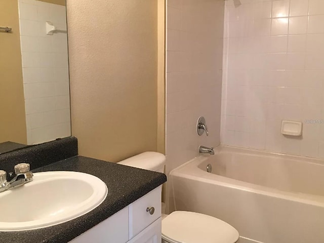 full bathroom with vanity, toilet, and tiled shower / bath