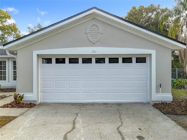 garage with concrete driveway