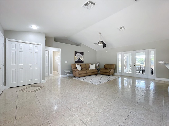 unfurnished living room with lofted ceiling, french doors, visible vents, and baseboards