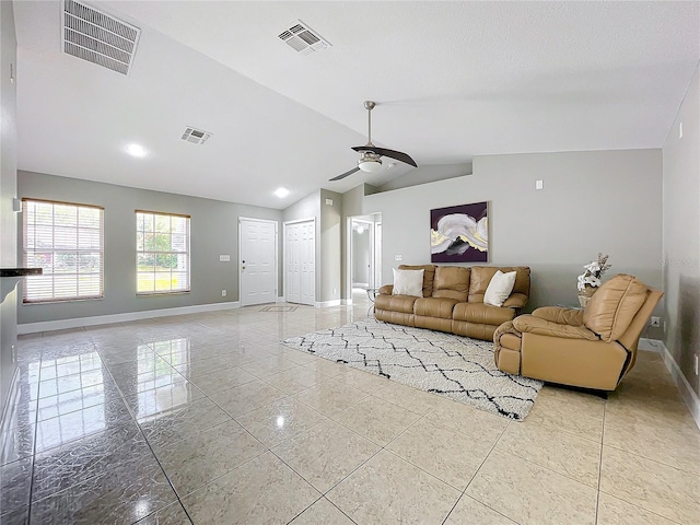 living room featuring vaulted ceiling, visible vents, and baseboards