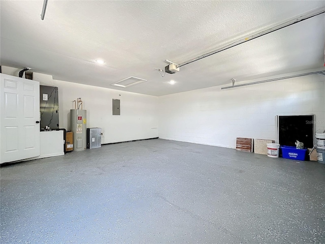 garage with electric panel, water heater, a garage door opener, and concrete block wall