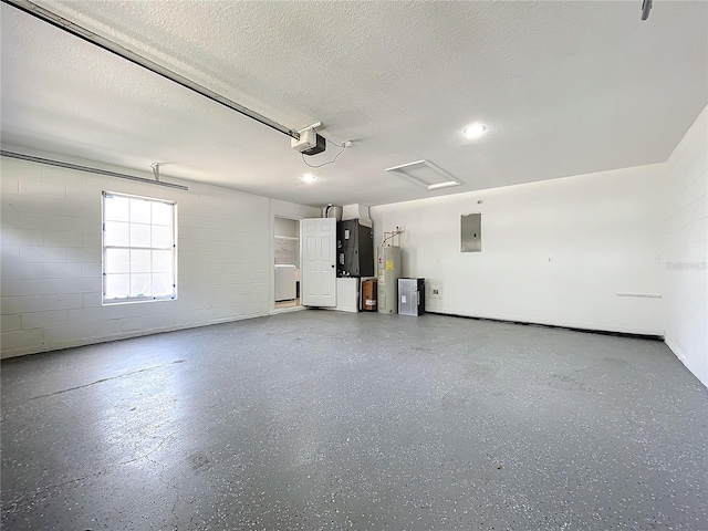 garage featuring concrete block wall, electric panel, a garage door opener, electric water heater, and heating unit