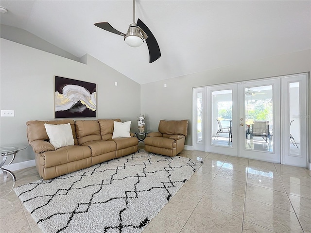 tiled living room with ceiling fan, french doors, and lofted ceiling