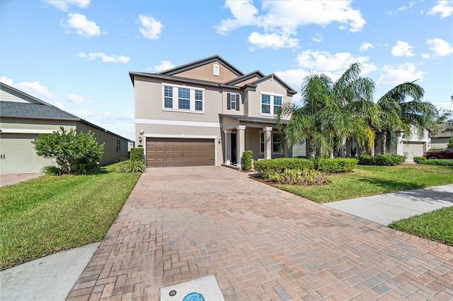 view of front of house with a garage and a front yard