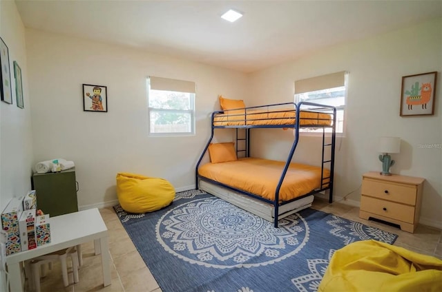 tiled bedroom with multiple windows