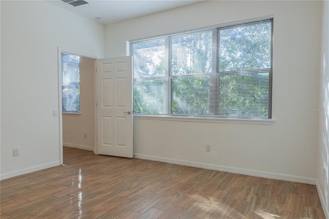 empty room featuring hardwood / wood-style floors