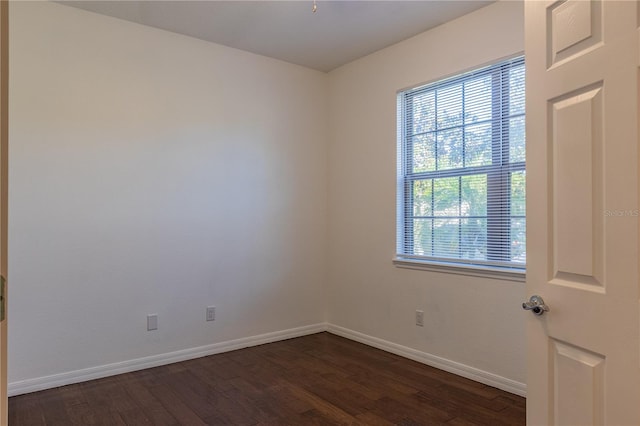 empty room featuring dark hardwood / wood-style floors