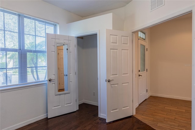 doorway featuring dark wood-type flooring