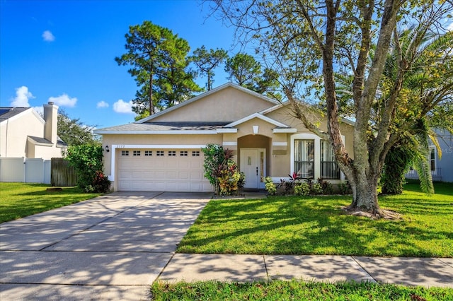 view of front facade with a front lawn and a garage