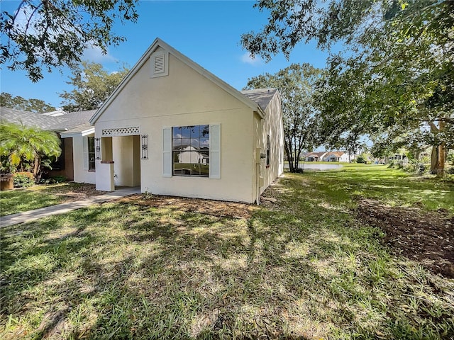 rear view of house with a yard