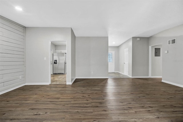 spare room featuring dark wood-type flooring