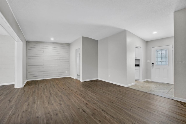 entrance foyer with a textured ceiling and wood-type flooring