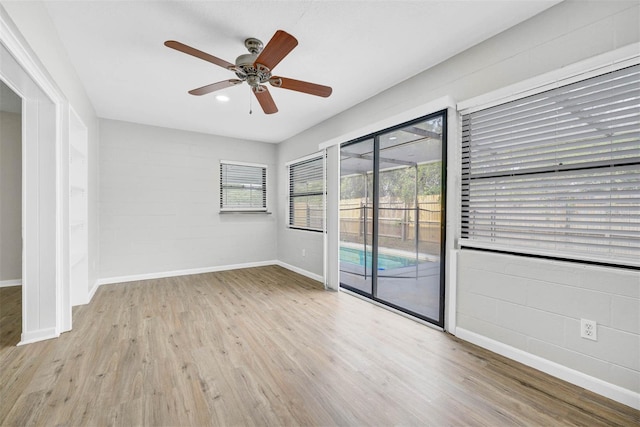 spare room with light hardwood / wood-style floors and ceiling fan