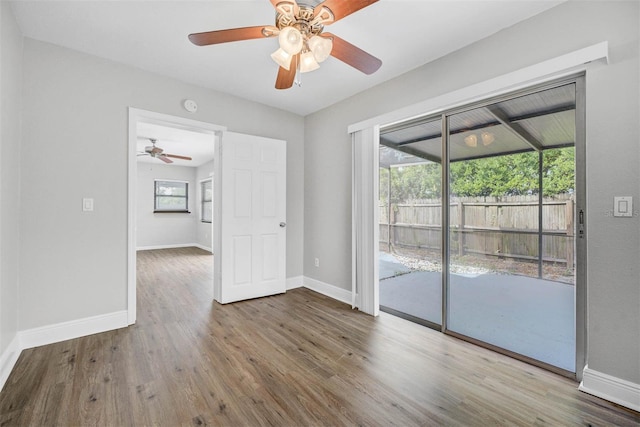 unfurnished room featuring hardwood / wood-style flooring and ceiling fan