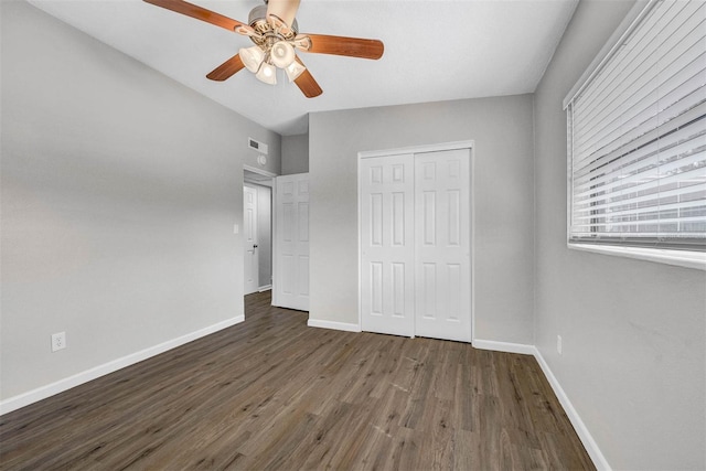 unfurnished bedroom with a closet, ceiling fan, and dark hardwood / wood-style floors