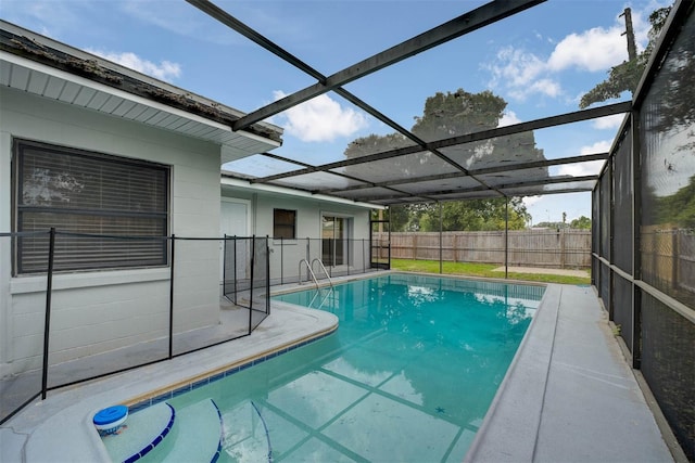 view of swimming pool with a lanai