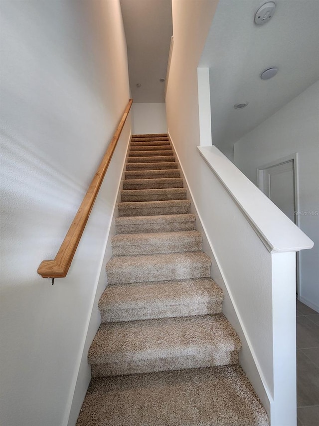 stairs with tile patterned floors