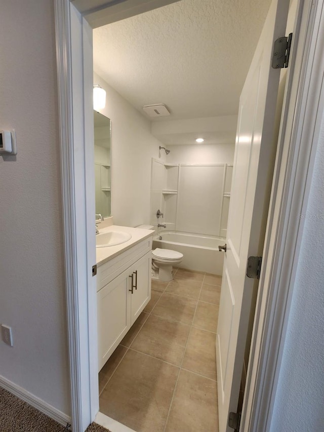 full bathroom with toilet, tile patterned flooring,  shower combination, vanity, and a textured ceiling