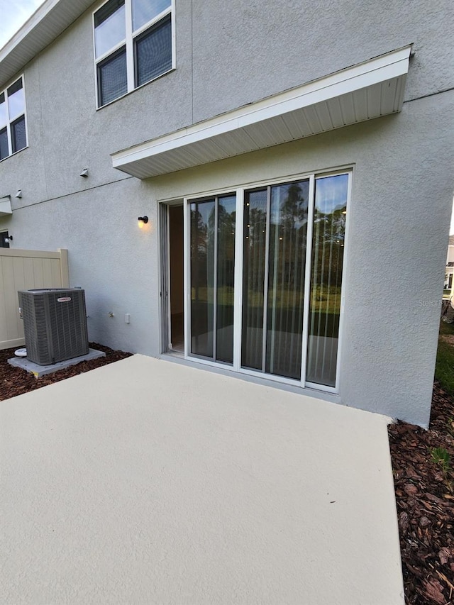 back of property featuring a patio area and central AC unit