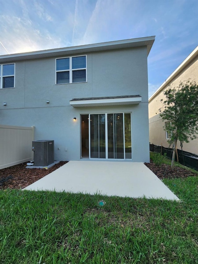 back of property featuring a patio and central AC unit