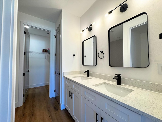 bathroom featuring hardwood / wood-style floors and vanity