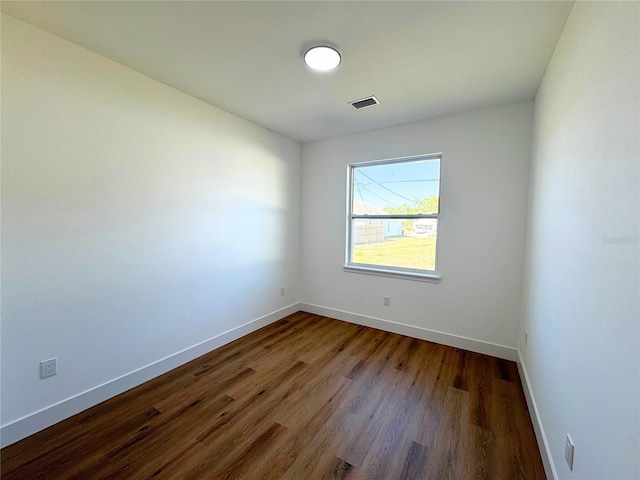 empty room featuring hardwood / wood-style flooring