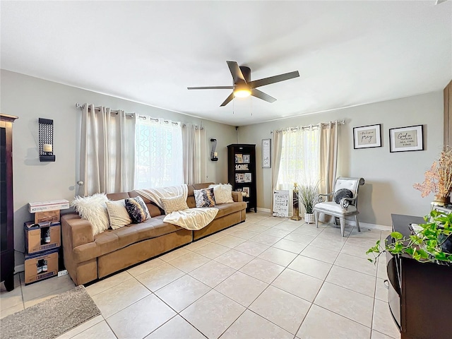 tiled living room featuring ceiling fan