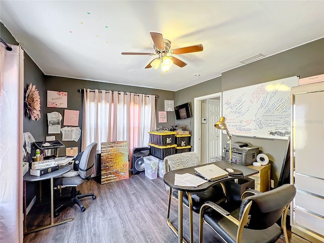 office with hardwood / wood-style floors and ceiling fan