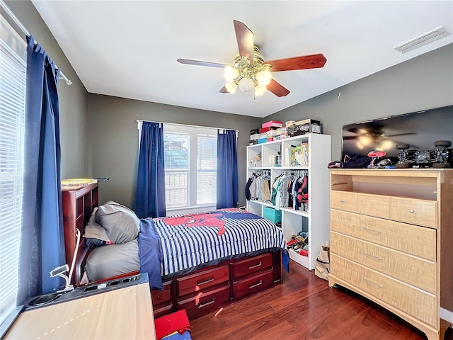 bedroom featuring ceiling fan and dark hardwood / wood-style flooring