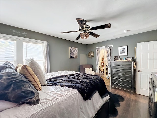 bedroom featuring dark wood-type flooring and ceiling fan