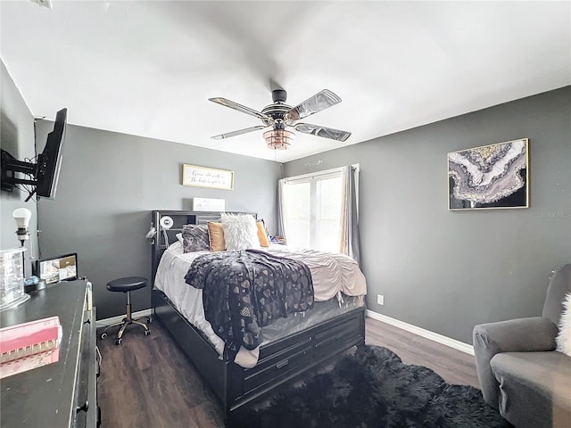 bedroom featuring dark wood-type flooring and ceiling fan