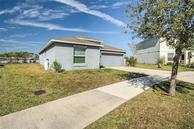 view of front facade featuring a garage and a front lawn