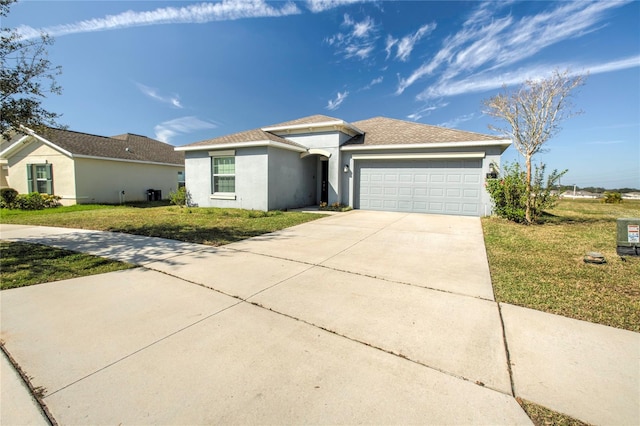 ranch-style house with a garage and a front lawn