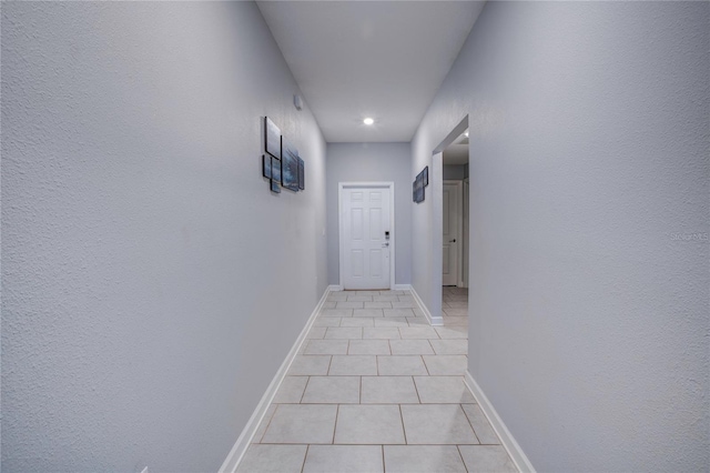 hallway with light tile patterned flooring