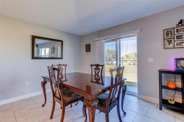 dining area with light tile patterned floors