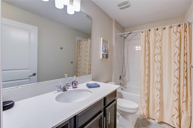 full bathroom featuring vanity, shower / tub combo with curtain, and toilet