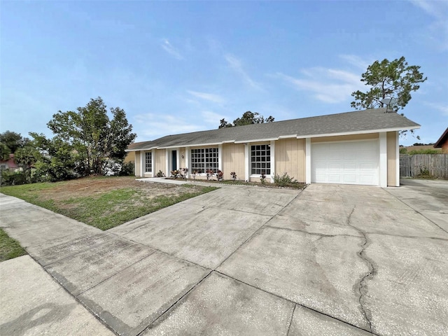 ranch-style home featuring a garage