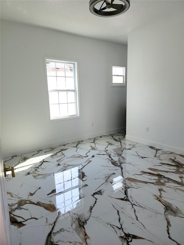 spare room featuring a textured ceiling